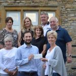 CT scanner appeal receiving a cheque for £12,000